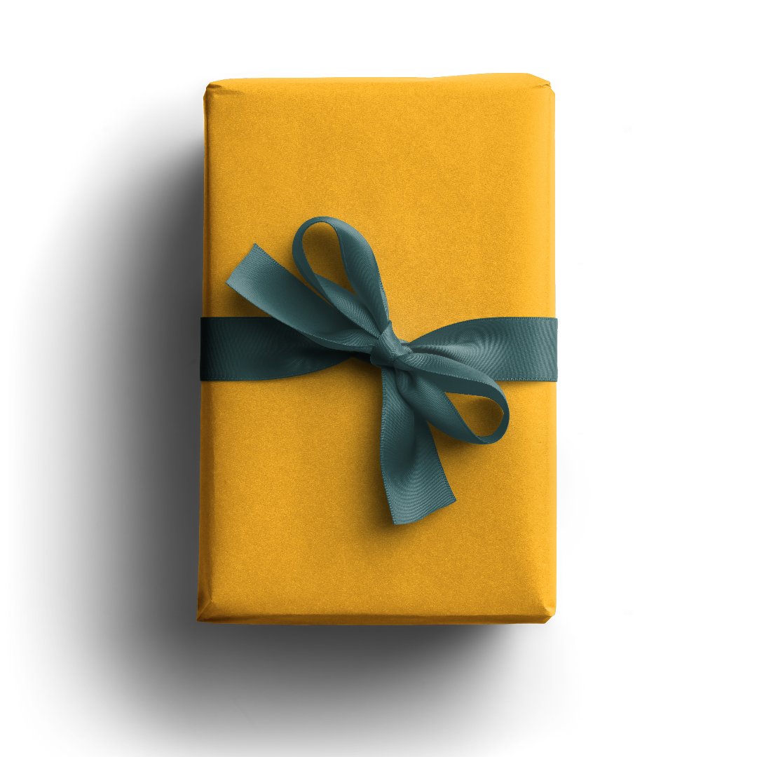 a parcel wrapped in yellow paper tied with a single bow in green ribbon