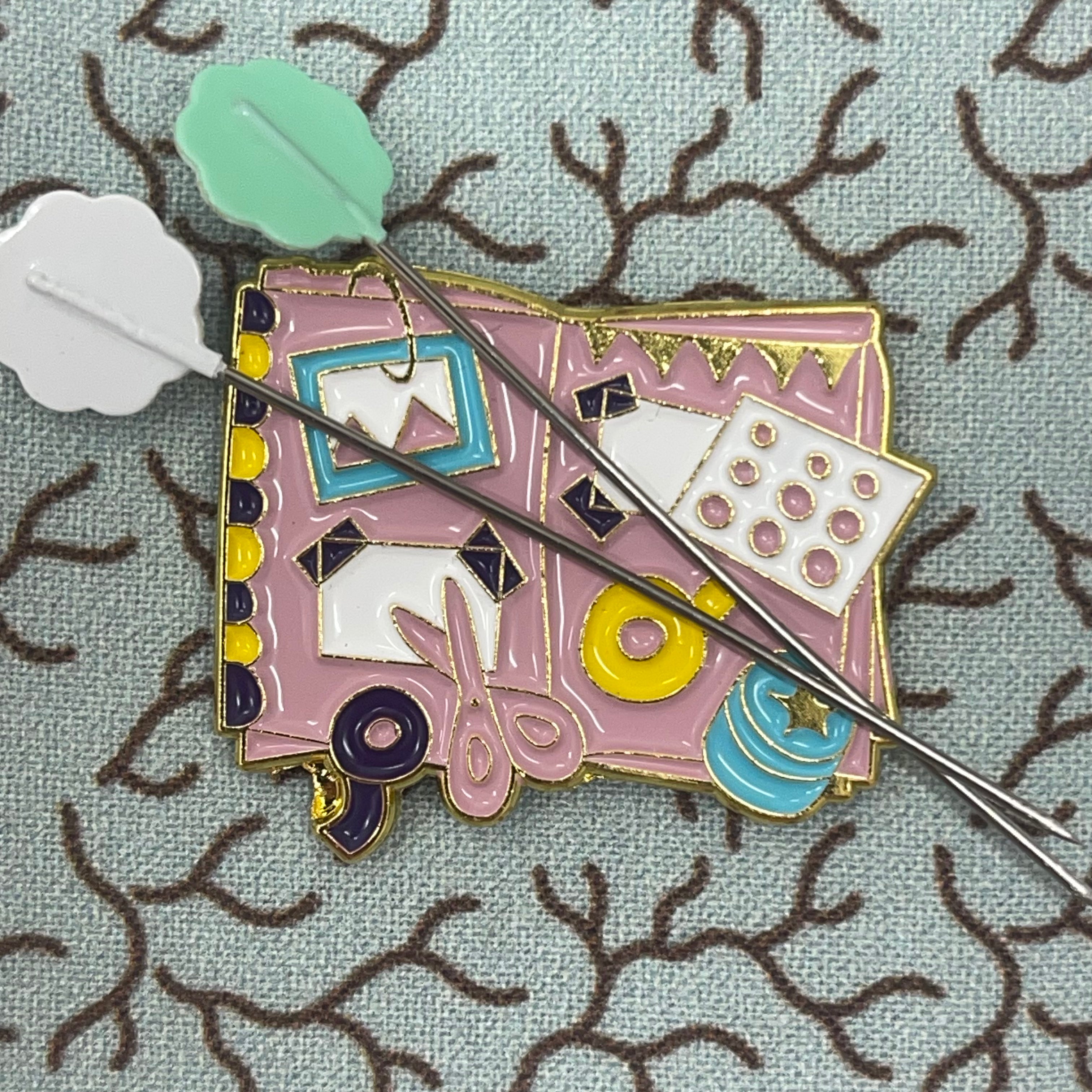 Crafting book needle minder